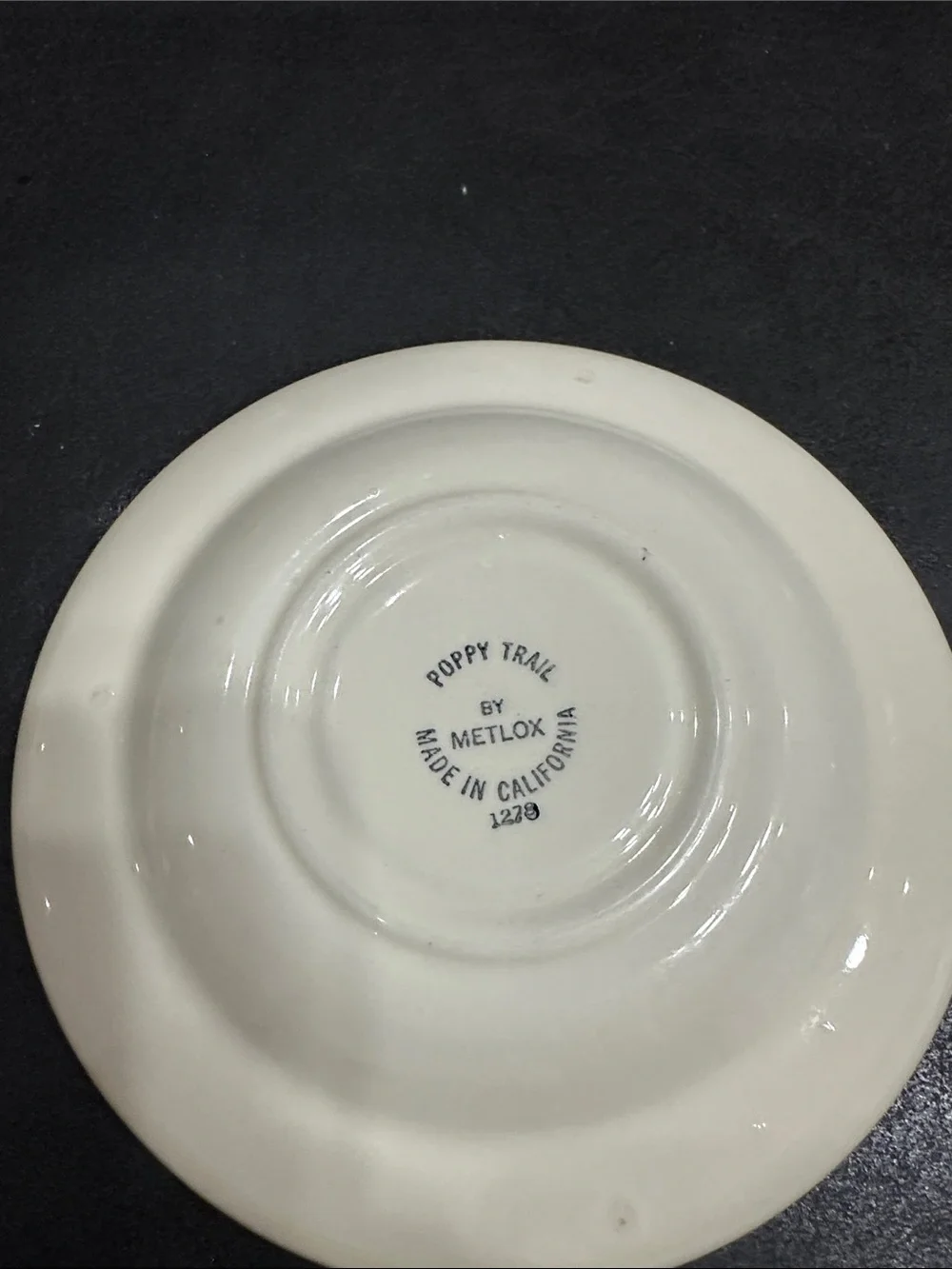 Set of 12 Poppy Trail by Metlix saucers.